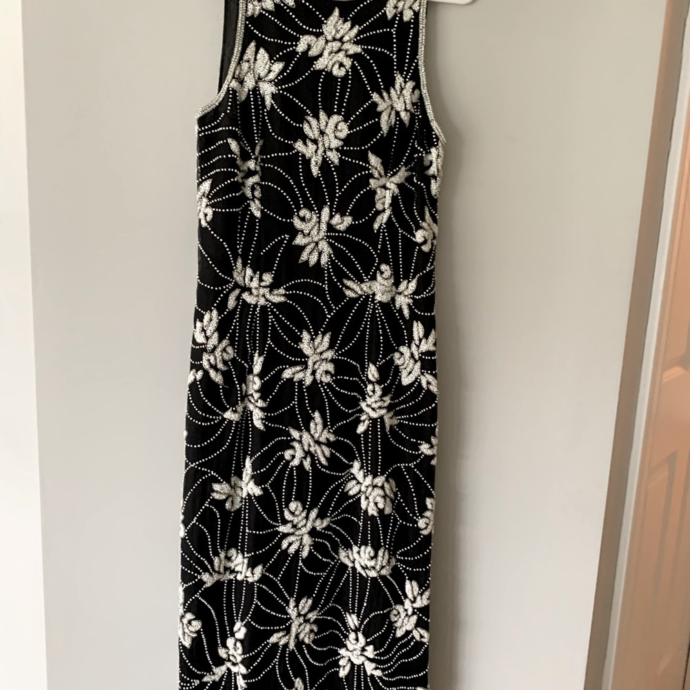 Nice cocktail dress used once. It was hemmed.